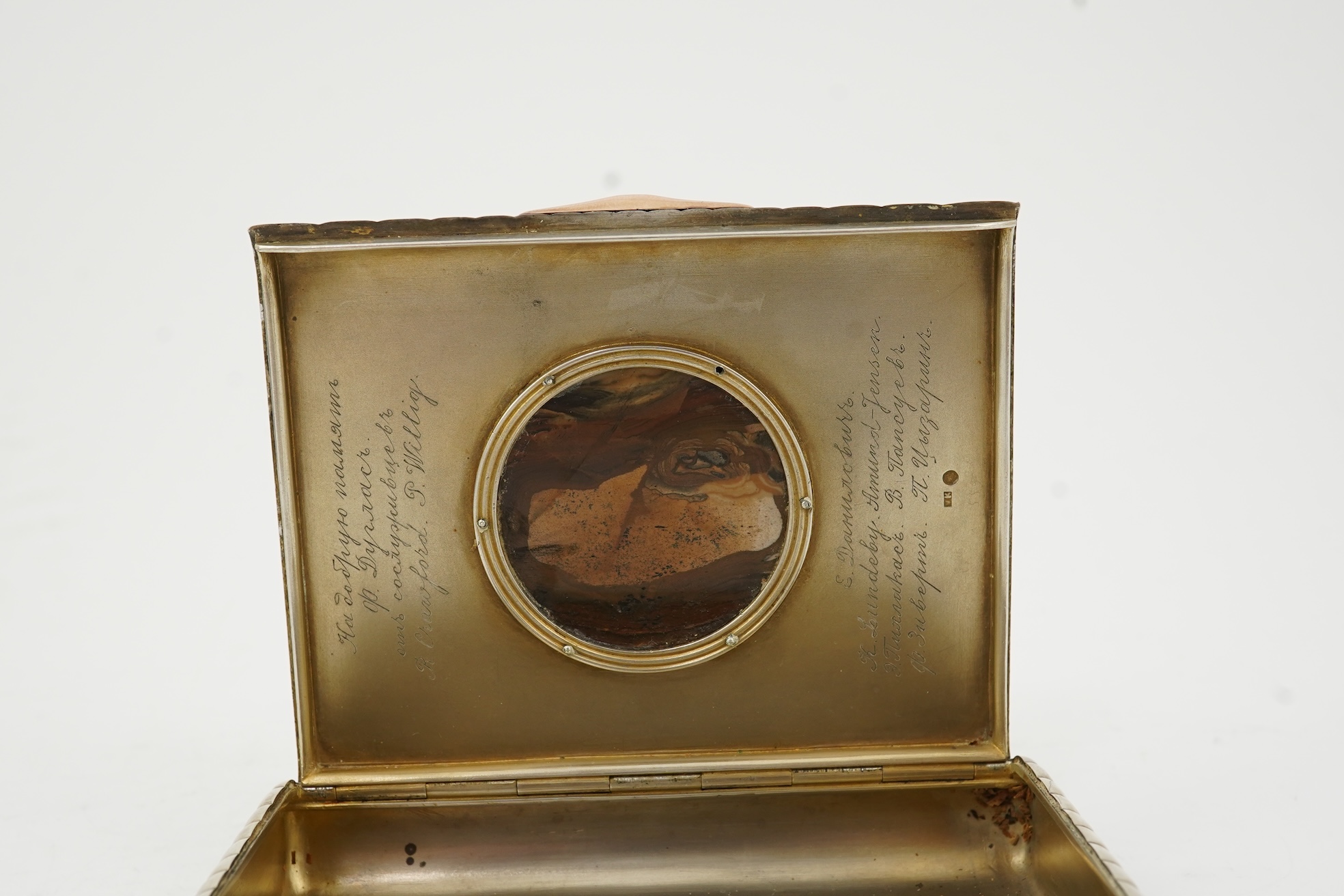 An early 20th century Russian 84 zolotnik silver cigarette case, with cappuccino agate inset cover, of ribbed rectangular form